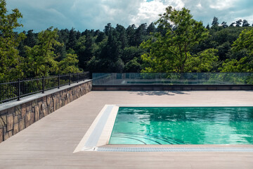 Luxurious swimming pool in nature, calm holidays