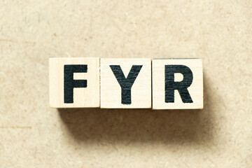 Alphabet letter block in word FYR (abbreviation of for your reference) on wood background - obrazy, fototapety, plakaty