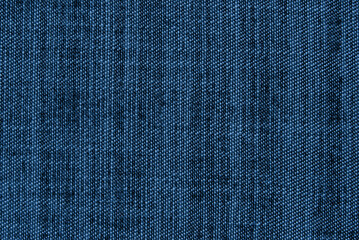 Navy blue color denim texture close up as background
