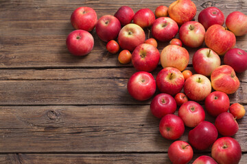 red apples on old wooden background