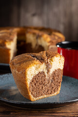 Marble cake and cup of coffee on the table.