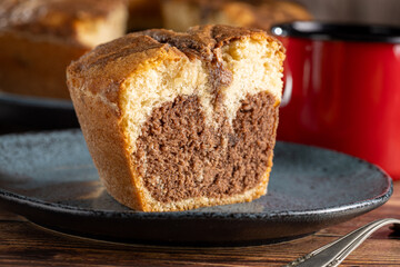 Marble cake and cup of coffee on the table.