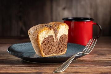 Marble cake and cup of coffee on the table.