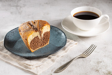 Marble cake and cup of coffee on the table.
