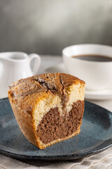 Marble cake and cup of coffee on the table.