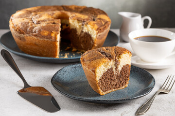 Marble cake and cup of coffee on the table.