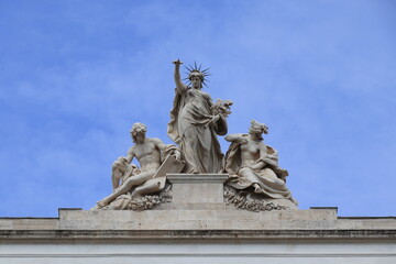 Group of Statues on the Roof of the Palazzo delle Esposizioni Building in Rome, Italy