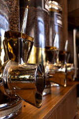 Hoppers of coffee beans in perspective.