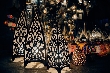 Glowing arabic lamps for sale in front of egyptian souvenir shop. Traditional middle eastern...