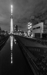 Skyline and river of Sumida Ward district in Tokyo, Japan at night