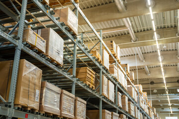  Long shelves with many cardboard boxes with product in warehouse of IKEA 