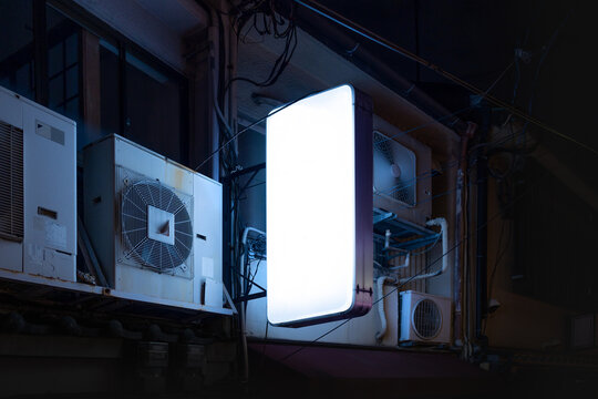 Blank Lightbox sign mockup in the urban environment, on the facade, empty space to display your advertising or branding campaign