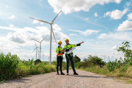 people engineer are wearing a protective helmet on head, using tablet Analytics engineering data