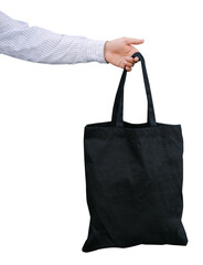 Young man holding black textile eco bag. Black eco bag for your design or logo mock up