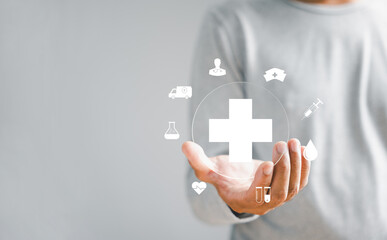 A plus sign is grasped by a businessman hand, signifying positive aspects, benefits, growth, social...