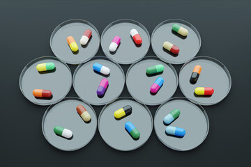 Various colorful antibiotics capsule pills on petri dishes on dark background. Illustration of the concept of pharmaceutical industry and antibiotic resistance