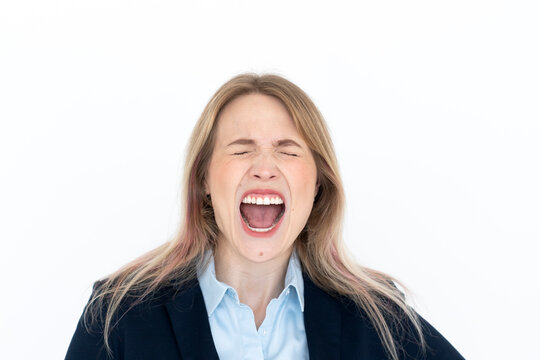 Close up portrait of hysterical business woman screaming isolated on white background	