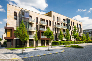 Fototapeta na wymiar Modern block of flats in suburban area, all trademarks carefully retouched