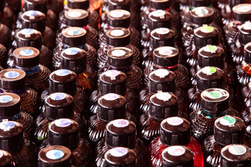 Selective focus of ink bottles in different colours.  Glass bottles 