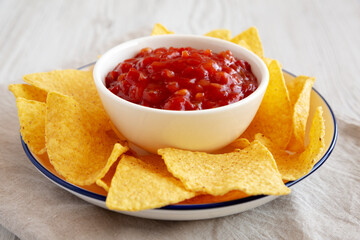 Homemade Salsa and Tortilla Chips on a Plate, side view. Close-up.