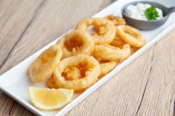 Crispy fried squid, Calamari  with tartar sauce and lemon