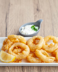 Crispy fried squid, Calamari  with tartar sauce and lemon