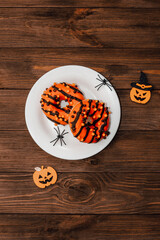 Donuts in black and orange glaze, a dish for Halloween