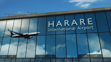 Obraz premium Airplane landing at Harare Zimbabwe airport mirrored in terminal