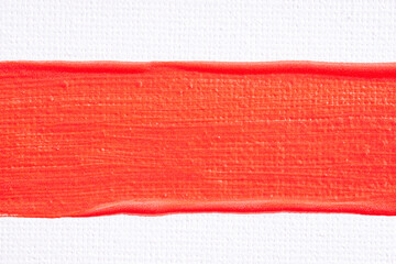 Smear of lipstick, lip gloss, paint, nail polish on a white paper canvas background. Bright red cosmetic product brush stroke sample. Textured red oil paint brush stroke..