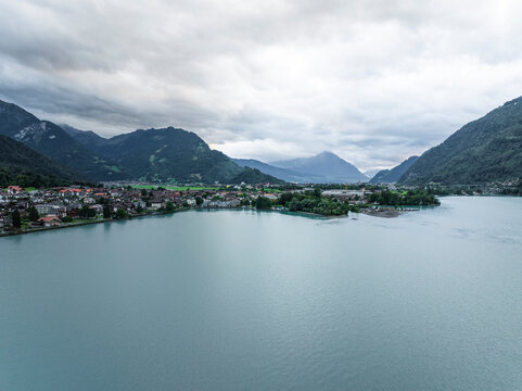 Aerial view of Bonigen, a small town along the Brienzersee Lake with rain and low clouds, Canton of Bern, Switzerland.