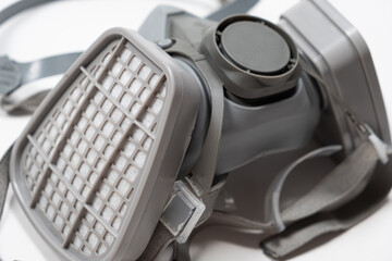 Respirator with dust and gas filters on a white background.