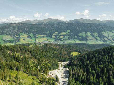 Aerial view of San Candido town as seen from Croda dei Baranci (Birkenkofel) mountain peak on the Dolomites range, Innichen, Trentino, South Tyrol, Italy.