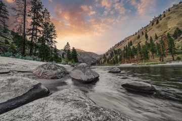  Wide angle long exposure view of little Salmon river on rocky beach with mountain views in Riggins Idaho © Shanna
