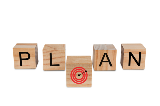 Place a wooden block with the text "PLAN" and a red dart board on isolated on  white background. Business idea for goals and successful growth process.PNG