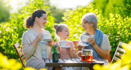 family drinking tea in the garden
