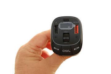 female hands with special device Bluetooth transmitter, or Bluetooth receiver, electronic device...
