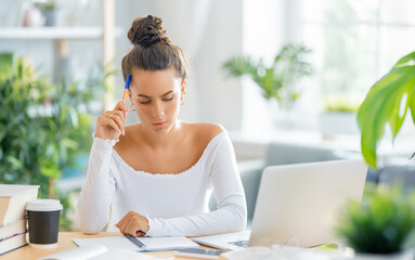 woman working on laptop at home