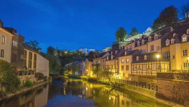 Grand Duchy of Luxembourg time lapse 4K, city skyline night timelapse at Grund along Alzette river in the historical old town of Luxembourg