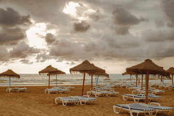 Beautiful beach. Chairs on the sandy beach by the sea. Summer vacation and vacation concept for tourism.