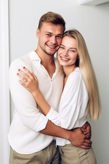 Fototapeta premium shot of a happy young couple posing together with their arms around each other