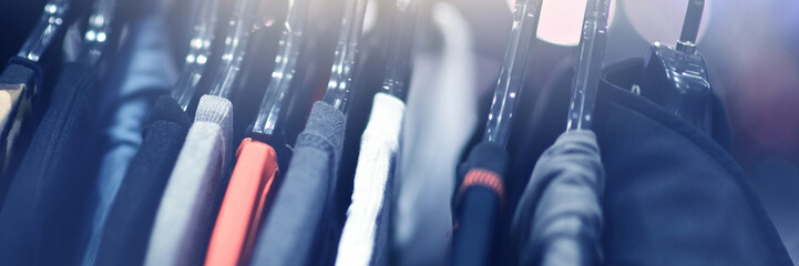 Clothes hangers are sold in luxury department stores. Selective focus