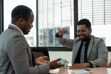 Real estate agent present house and land to their client by offering example of model home Introducing home loan, home model, concerning mortgage loan offer for and house insurance