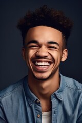 Obraz premium shot of a young man smiling while posing in studio