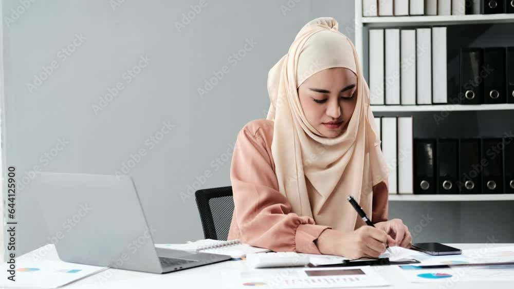 Poster positive muslim accountant clerk in hijab work with papers at desk in modern glass office concentrat