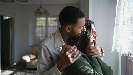 Empathetic boyfriend providing emotional support and comfort to his tearful girlfriend during a challenging period