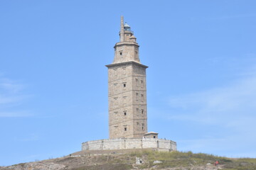 Fototapeta na wymiar Lighthouse Legacy: The Hercules Tower and a Blue Horizon