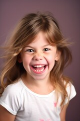 portrait of a happy little girl making funny faces with copyspace