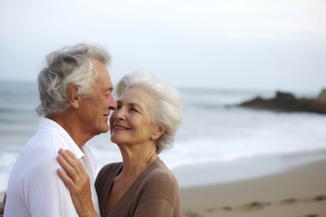 Fototapeta na wymiar portrait of a senior woman enjoying the beach with her husband