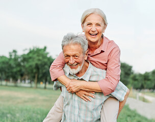 woman man outdoor senior couple happy lifestyle retirement together smiling love fun elderly active...