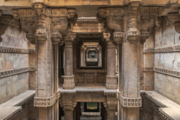 Intricate carvings inside heritage structure of Adlaj step-well also known as Rudabai step-well and...